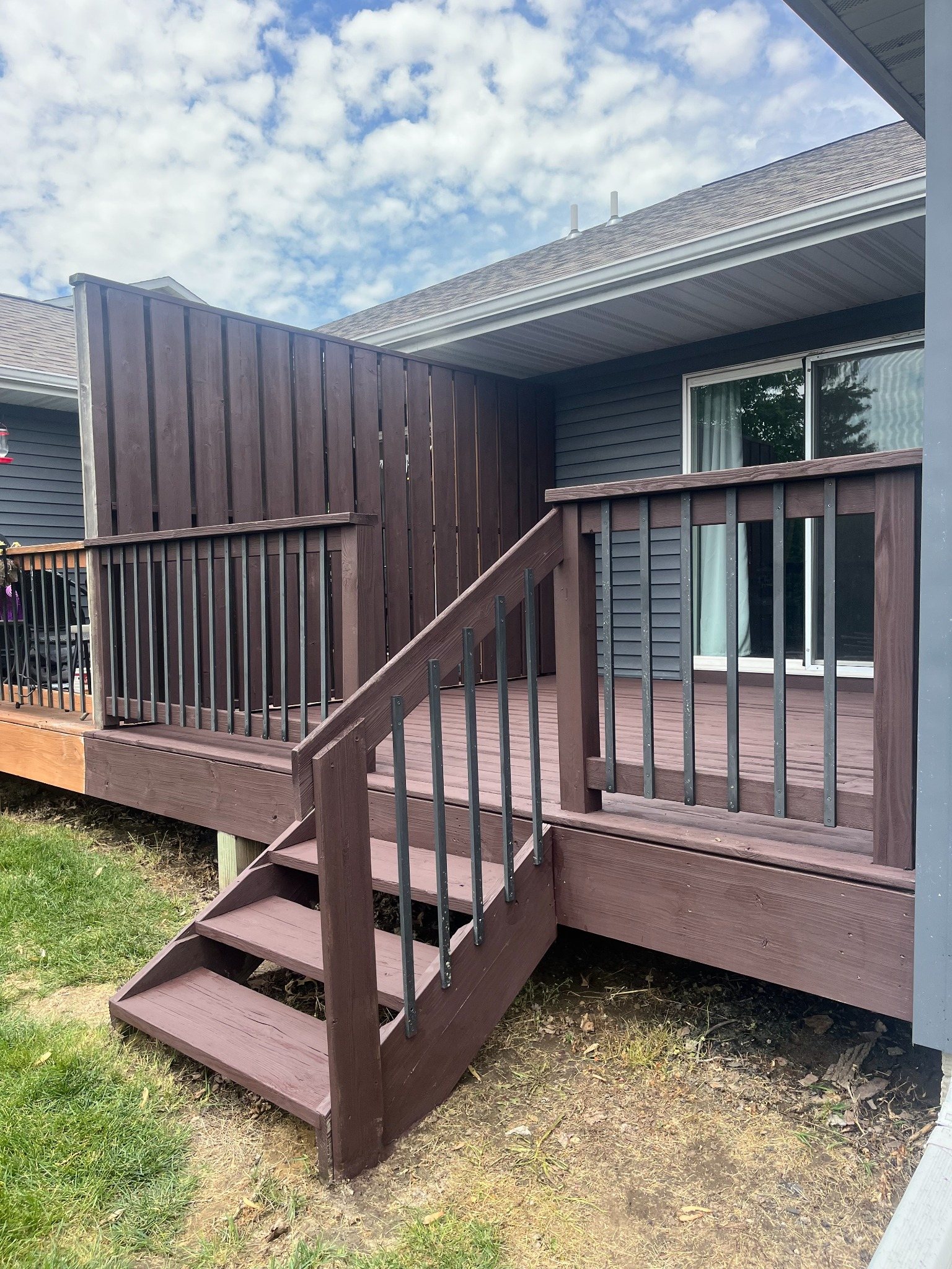 Deck privacy wall staining before and after